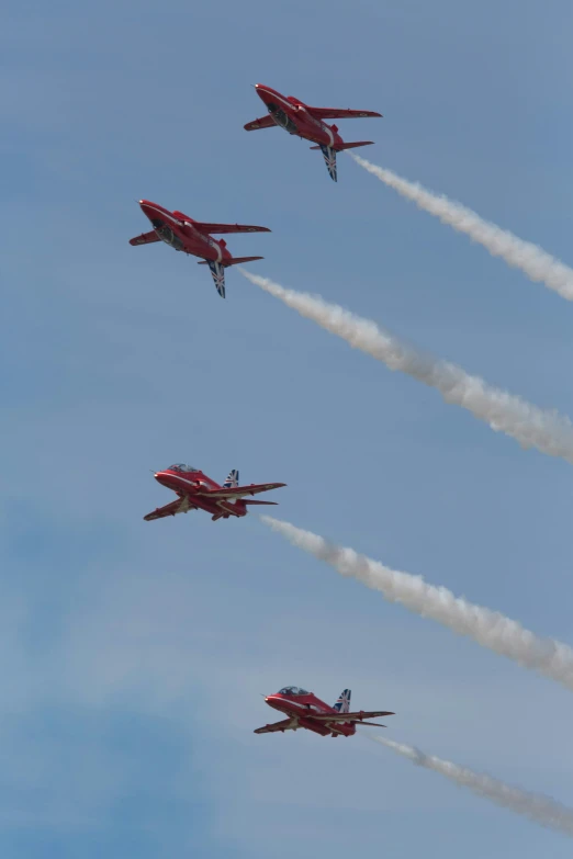 four fighter jets flying close to the camera