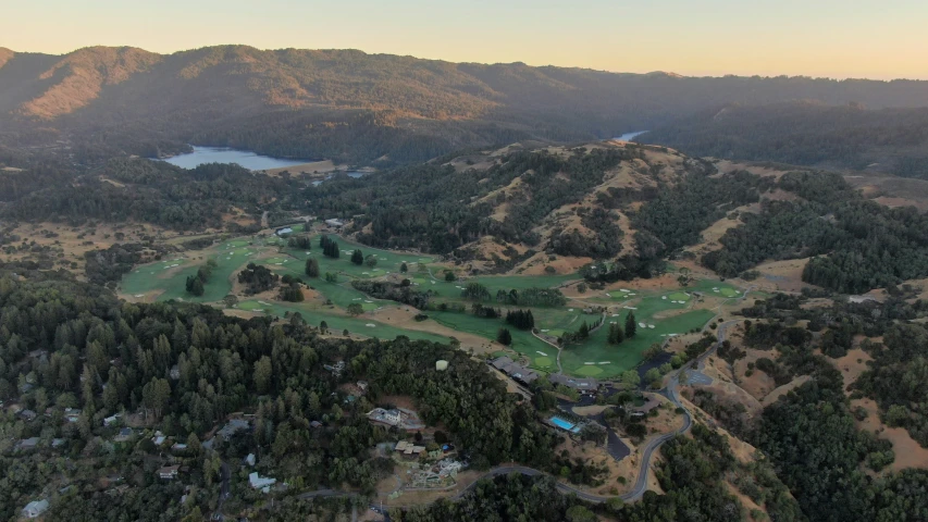 the view of the course and mountains from a helicopter