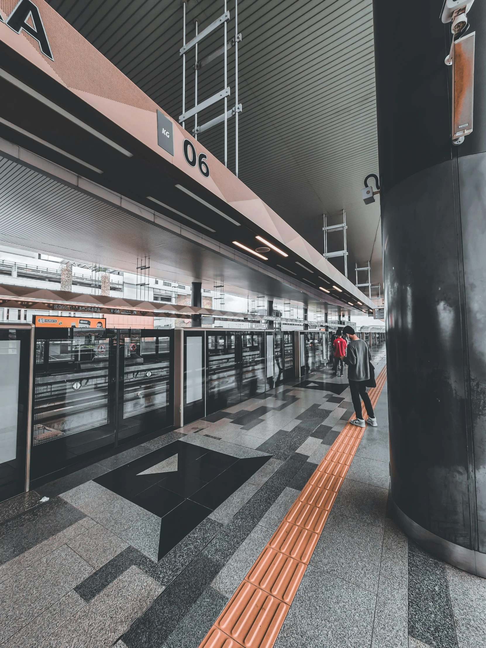 a person in a subway station with luggage