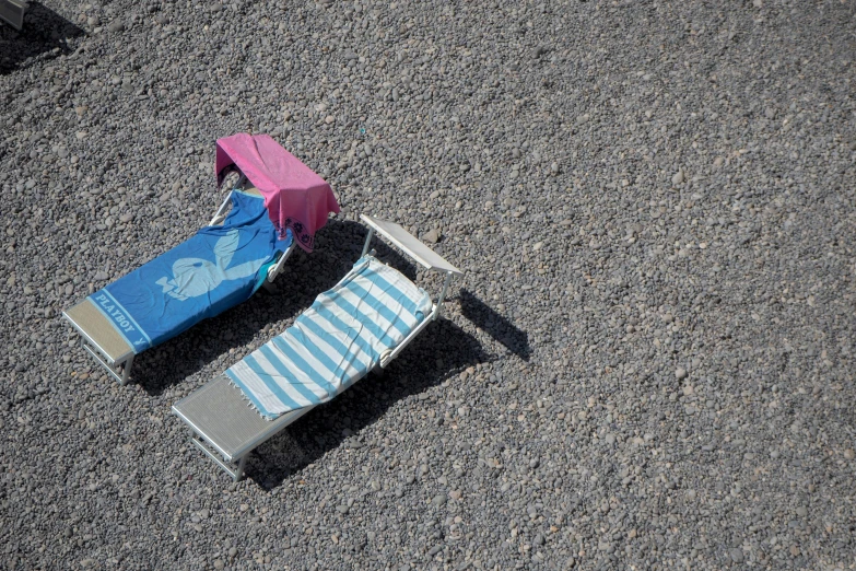 a chair laying on the ground in front of another chair