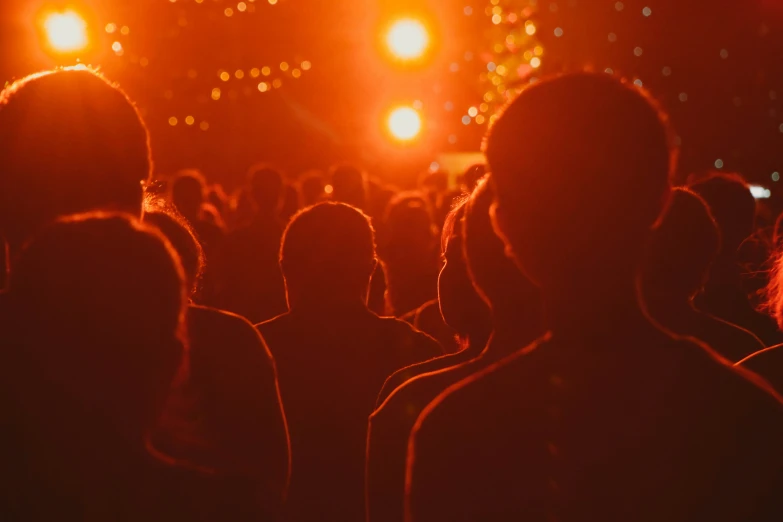 a crowd of people are shown at night