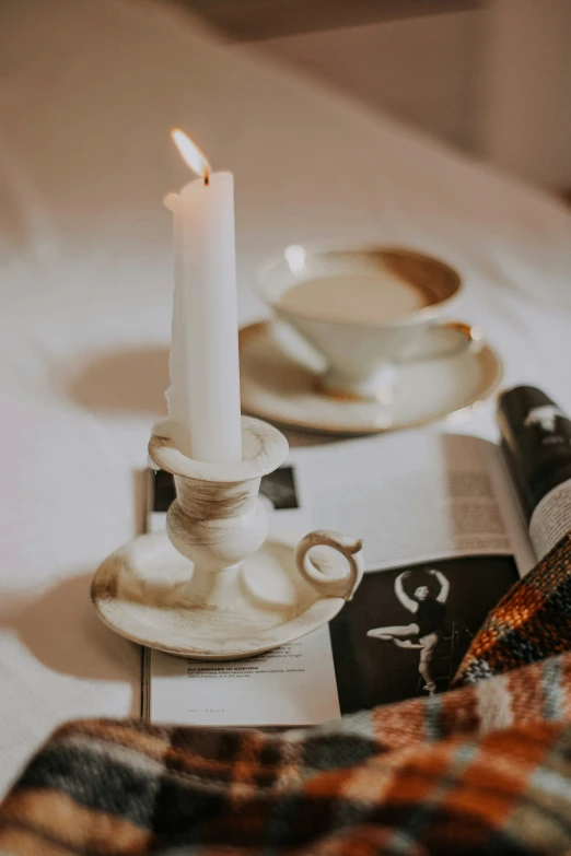 the candle is burning in the middle of a table