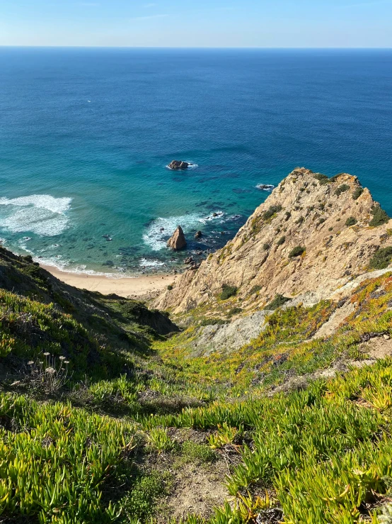 there are many hills near the ocean on this beach