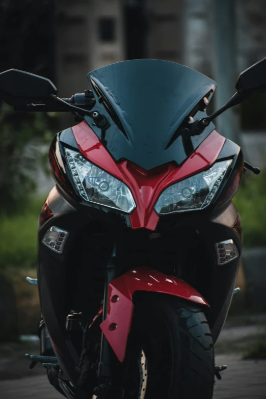 a closeup po of the front end of a red motorcycle