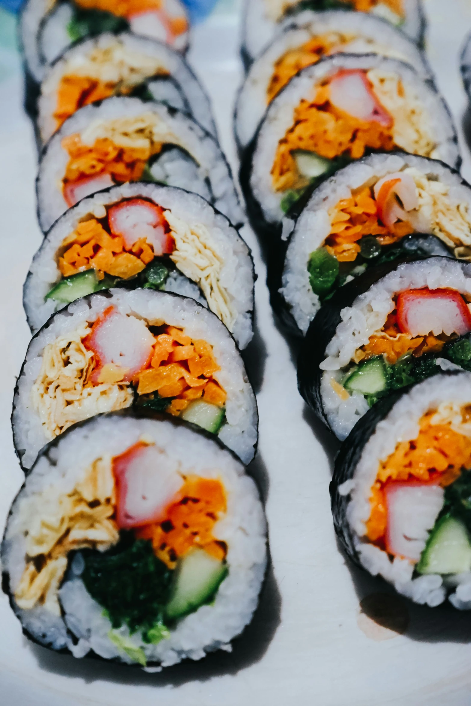 a plate full of sushi on a table