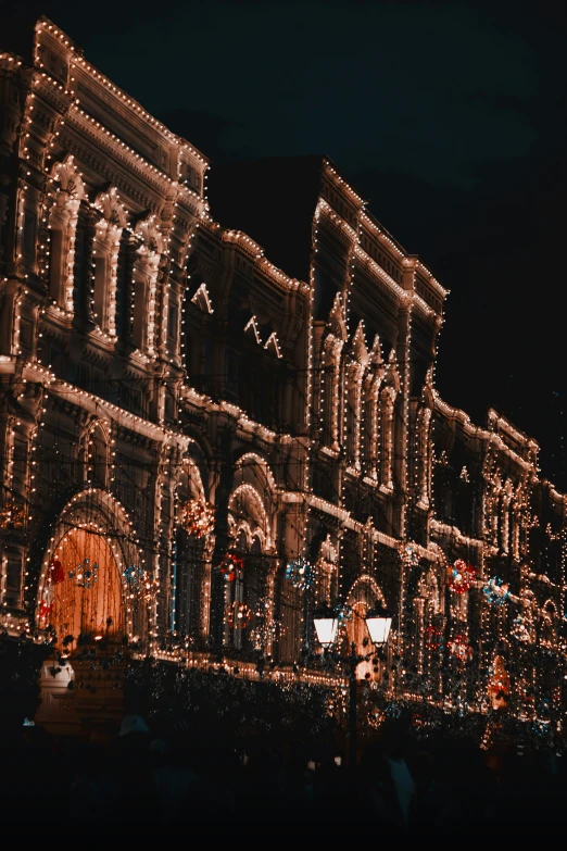 many buildings all decorated in christmas lights