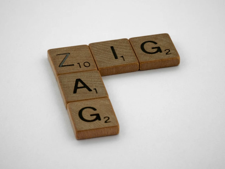 a group of scrabble tiles spelling out the word zigg