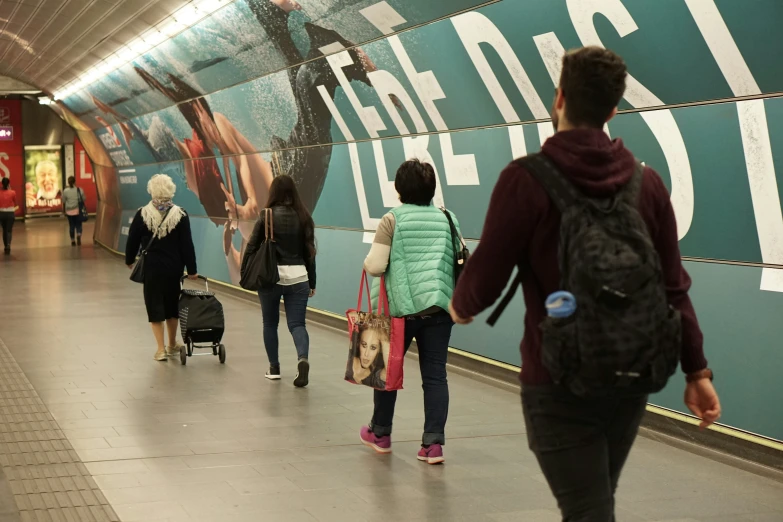 people in line waiting to board the train