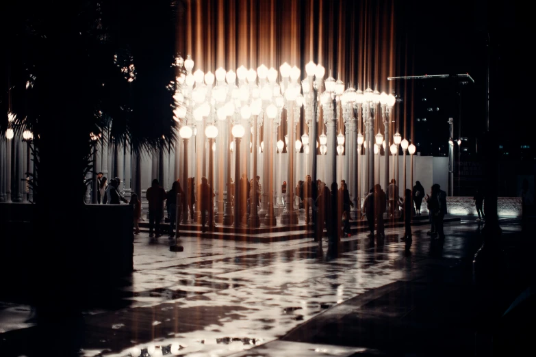 a chandelier and a dark floor outside a building