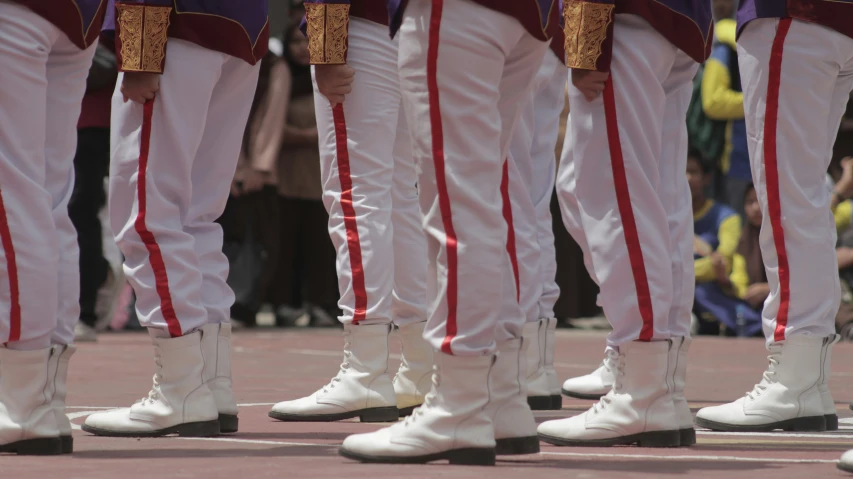 there are men in uniform with white boots