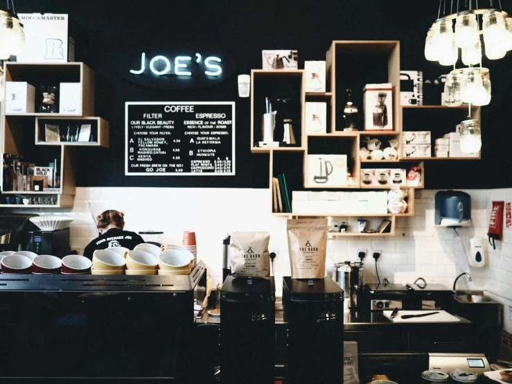 a wall mounted menu on a wall in a kitchen