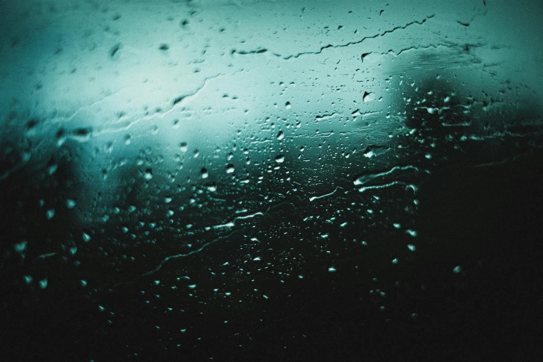 rainy rain drops on the window of a car at night