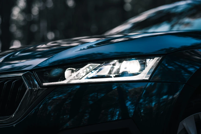 the headlights on a dark blue car