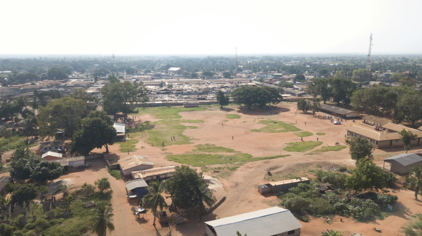 an aerial view of a field with some houses