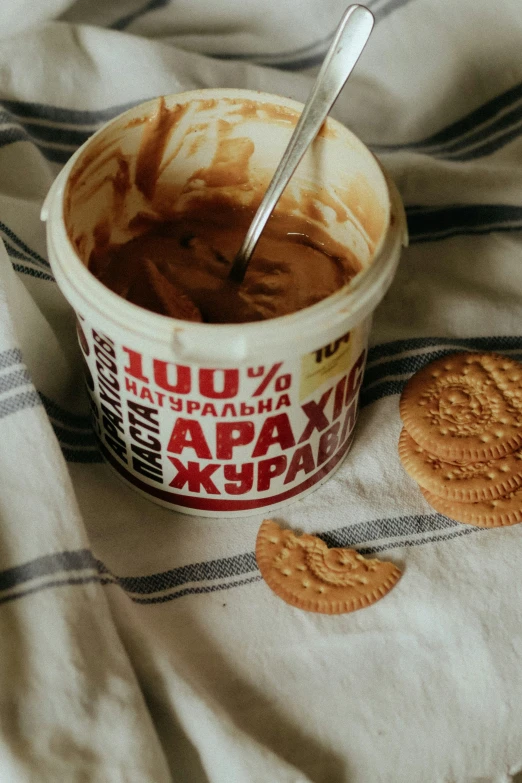 an ice cream, oreo cookies and dip in a cup