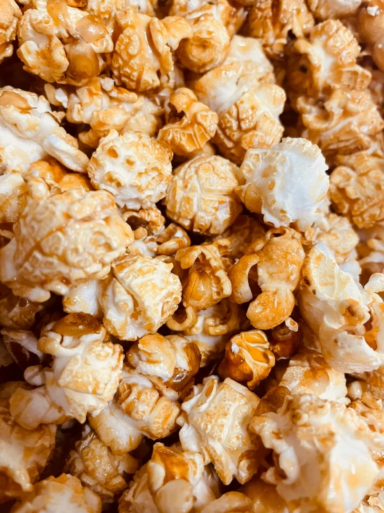 popcorn kernels mixed with a bowl of popcorn