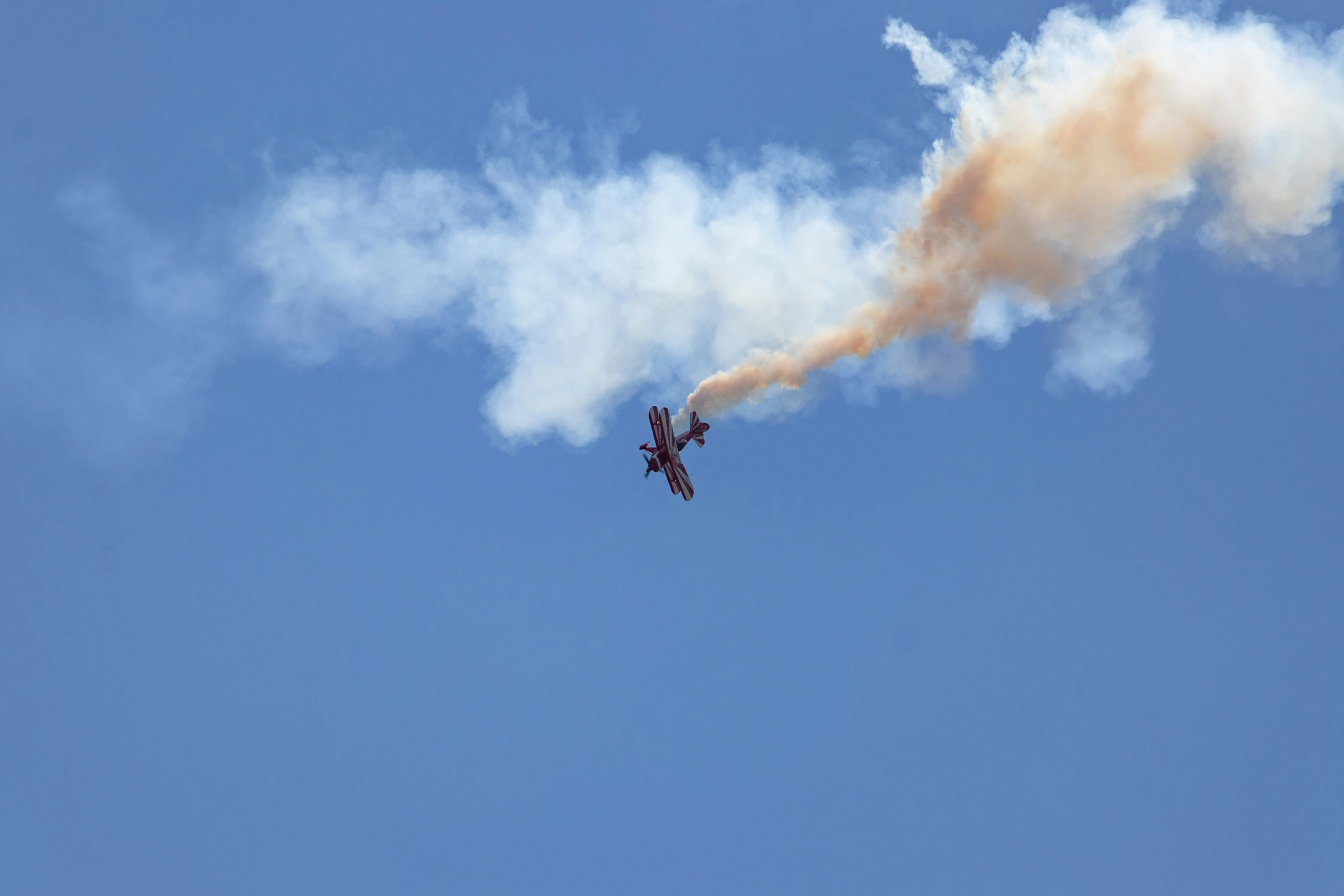 the smoke comes from an old airplane in the sky