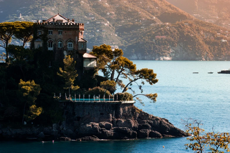 a castle like structure sits on an island in the water