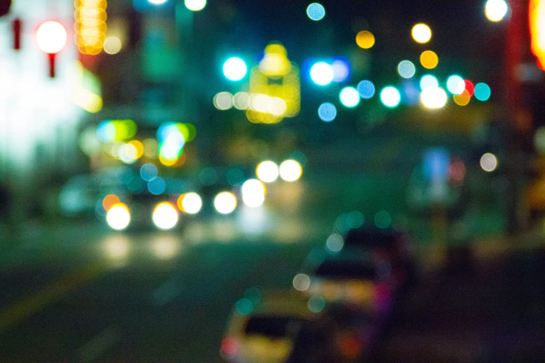 blurry view of a street at night with city lights