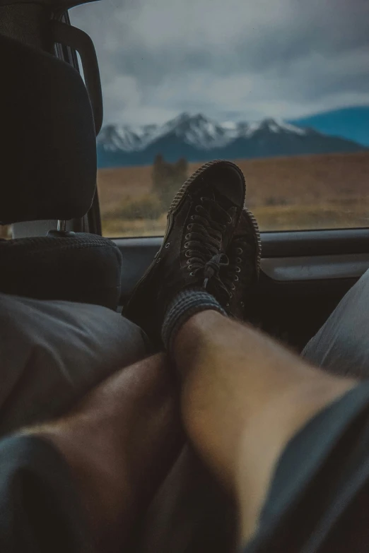 feet up and down in the passenger seat of a car