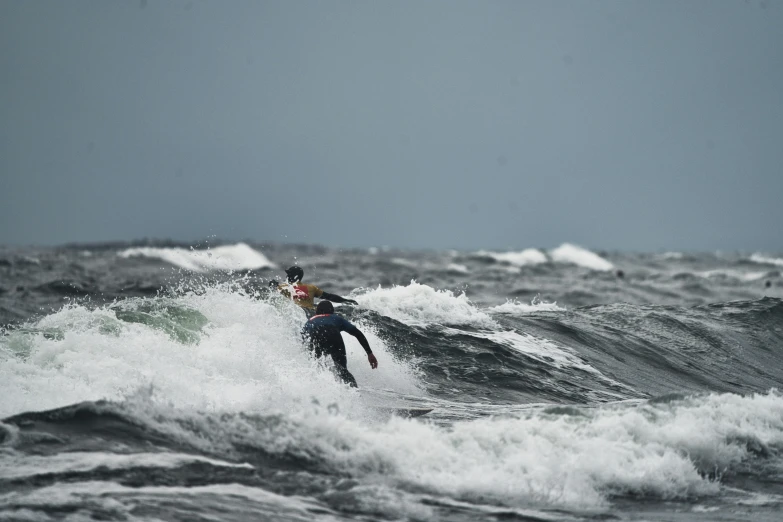 a surfer is riding on a wave in the ocean