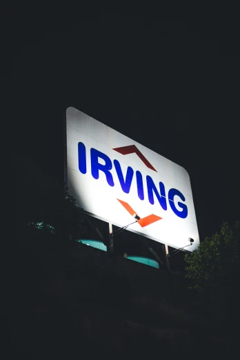 a large invining sign sitting on the side of a building