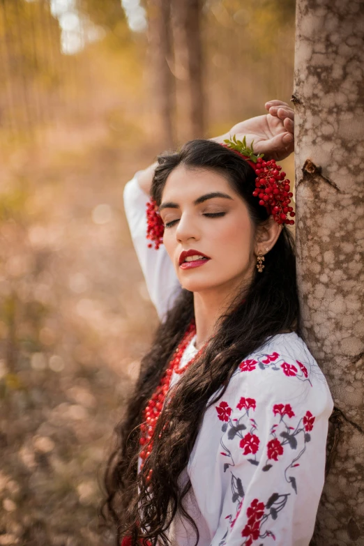 a woman with long hair wearing flowers on her head