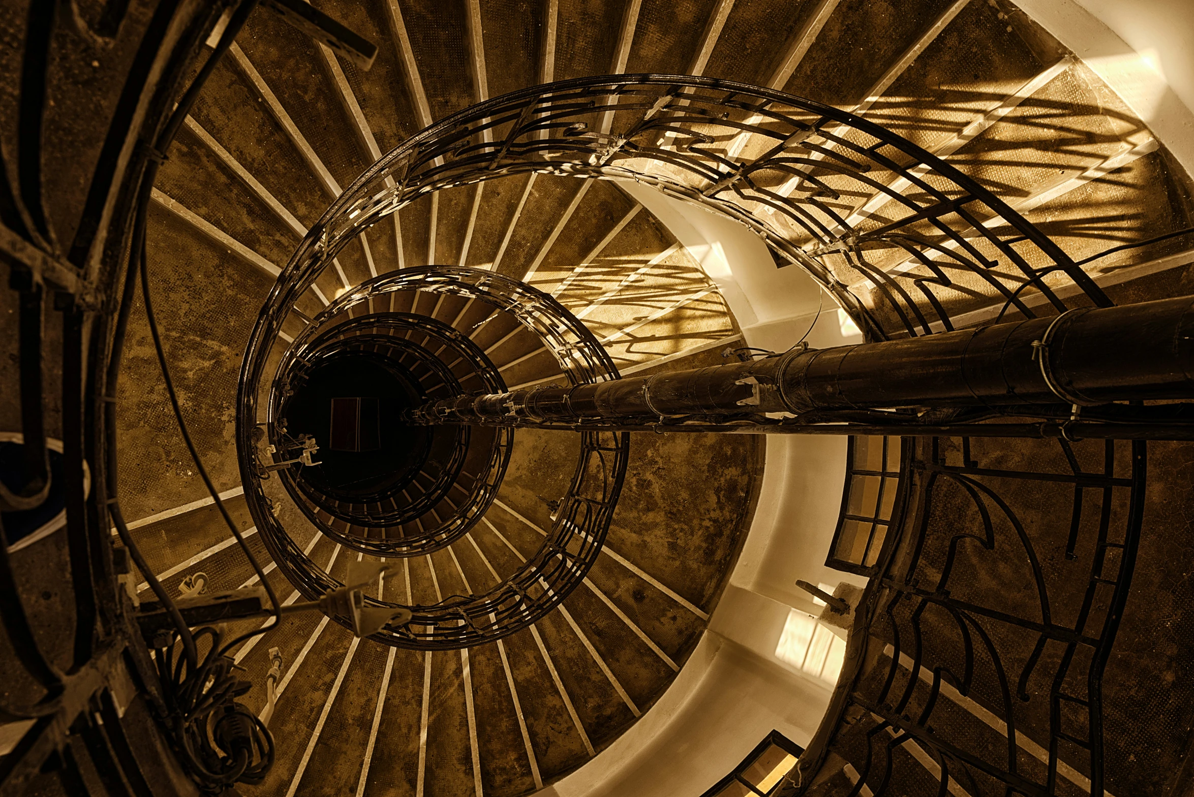 the view down into an old spiral staircase