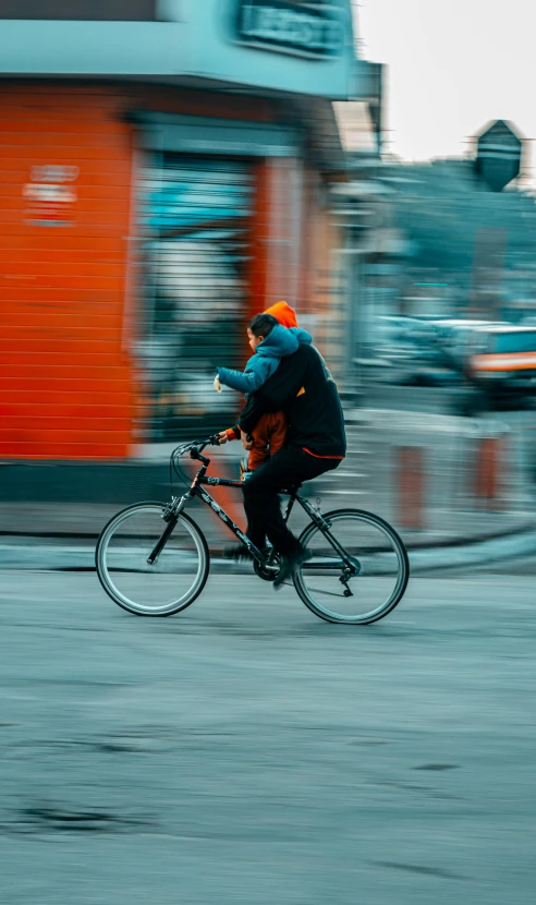 a man in the city riding his bike in the street