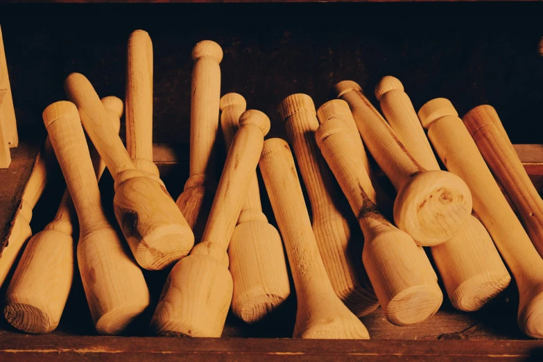 several wooden pegs lined up to form balls