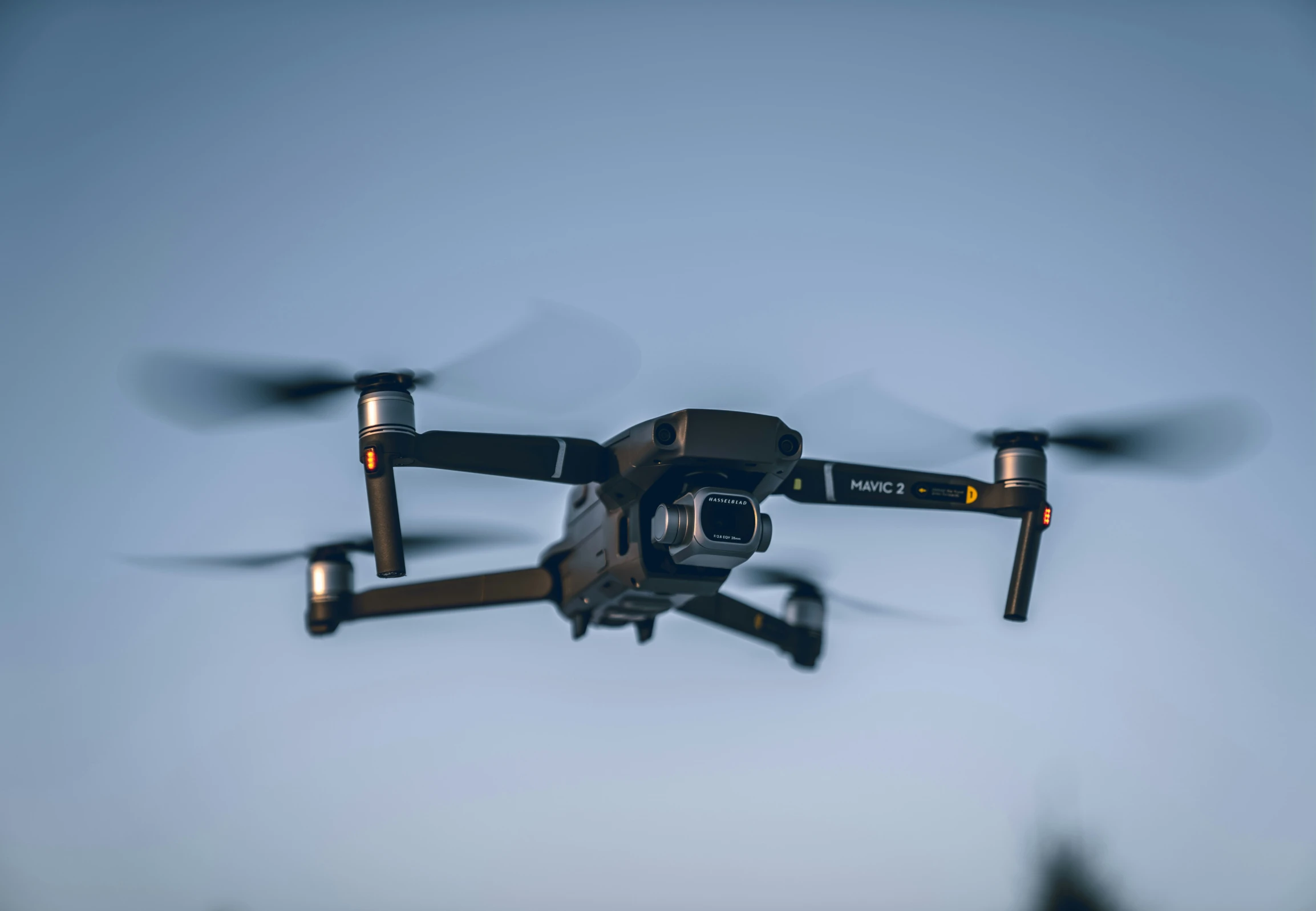 a large remote control airplane flying in the sky