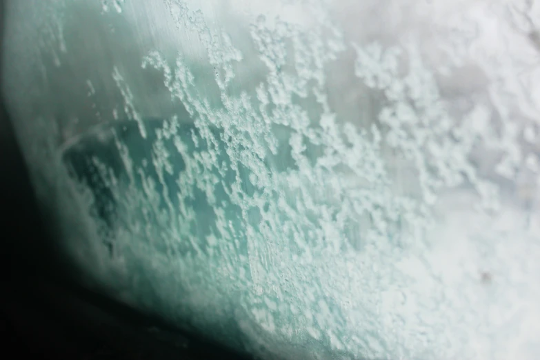 the rain fell down the windshield of a vehicle