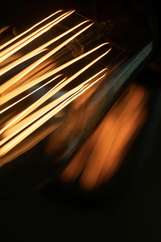 blurred pograph of a toaster oven door with many sticks cooking