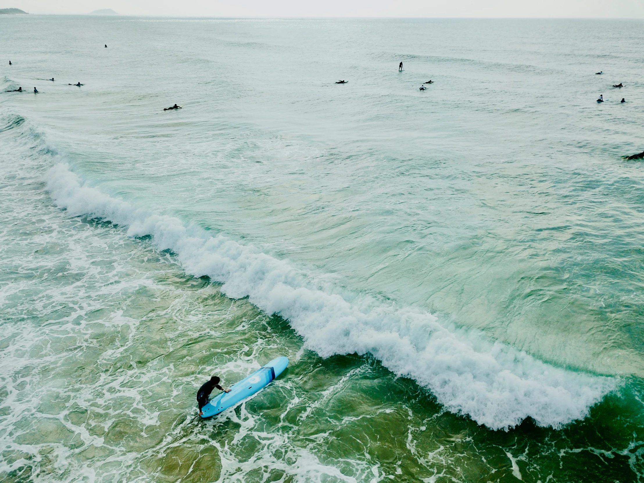 a person on a surfboard in the water