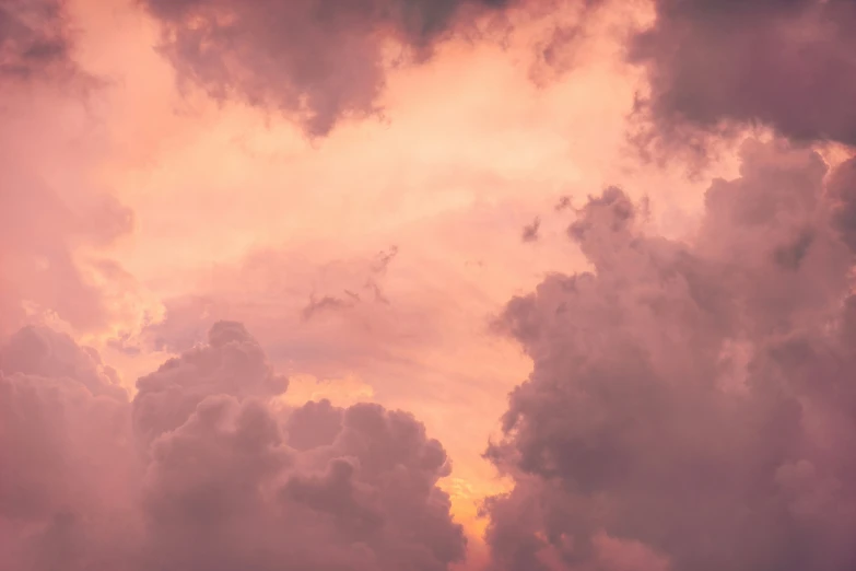 some planes flying through some clouds on a cloudy day