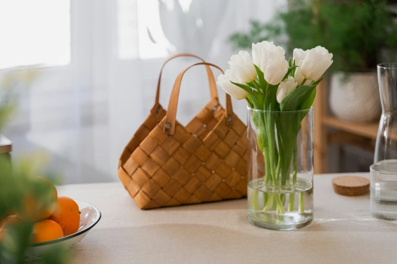 some flowers are in a vase on a table