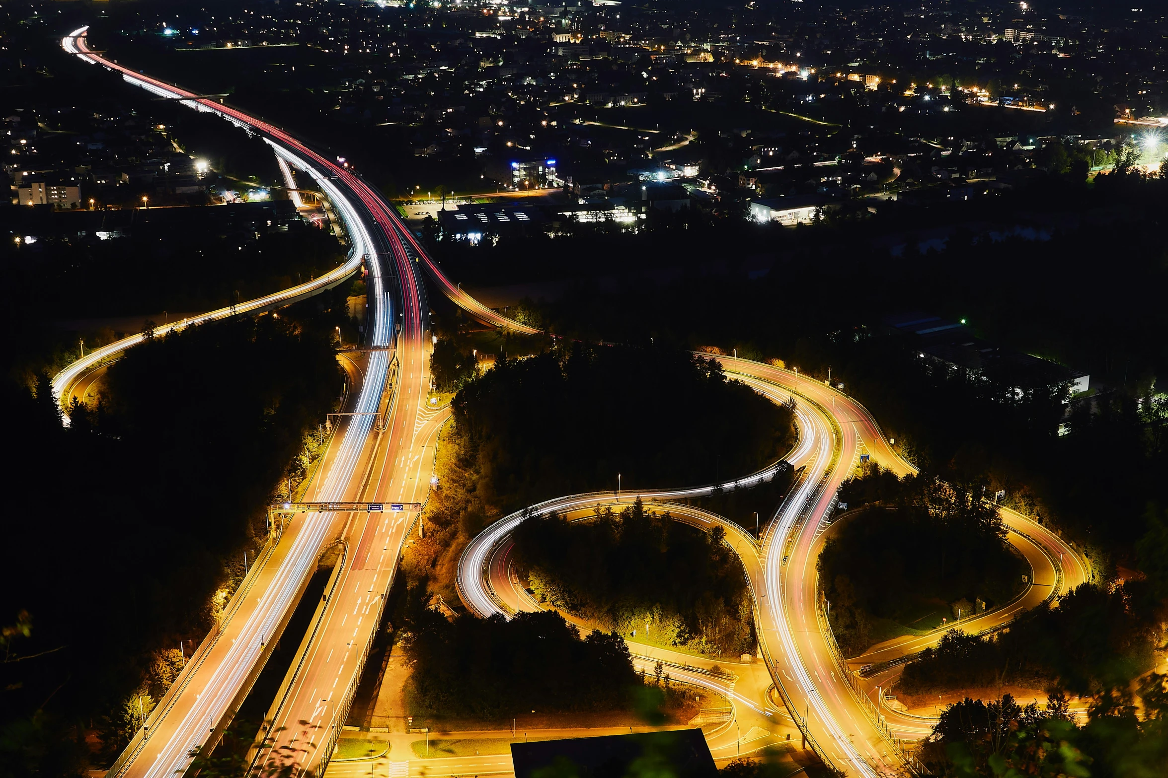 a view of the highway at night from a height