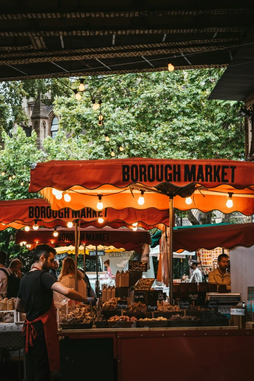 an outside covered market is on display in the day