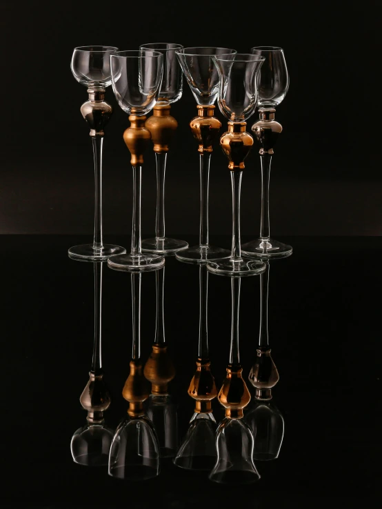 a table topped with wine glasses and a clock