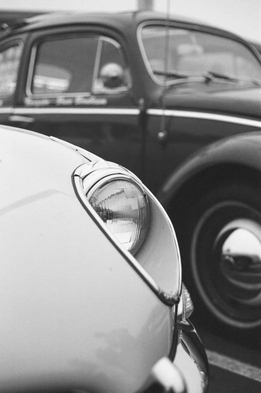 some old fashioned car parked side by side