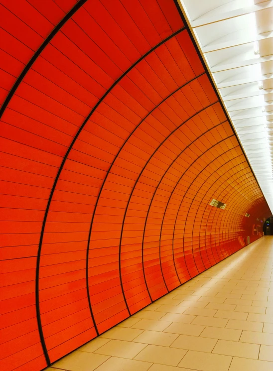 a tunnel inside of a building with tiled floor