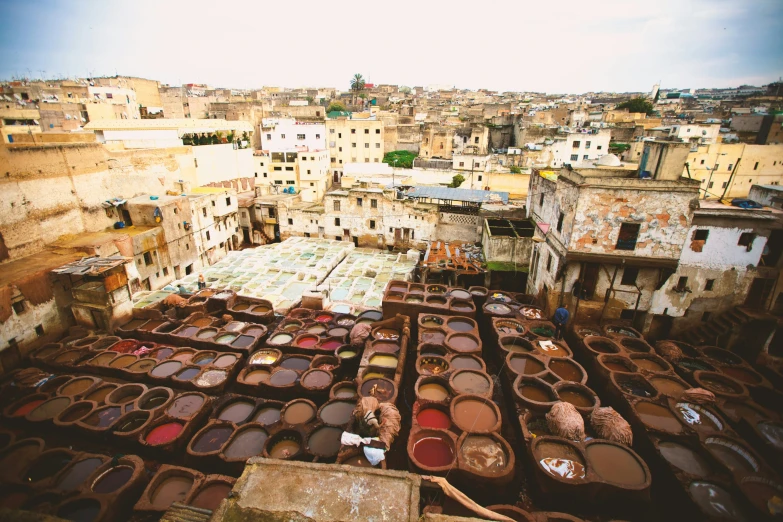 the roof top of a building covered with pots