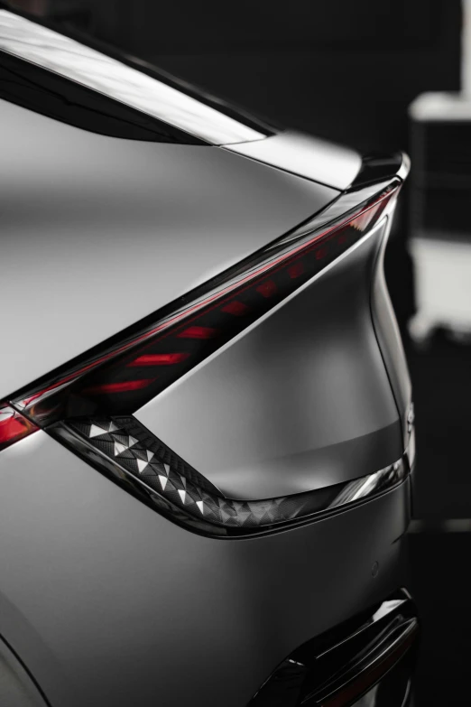 the hood and tail lights of a new car