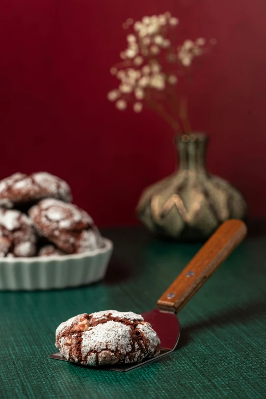 powdered sugar is on top of brown cookies