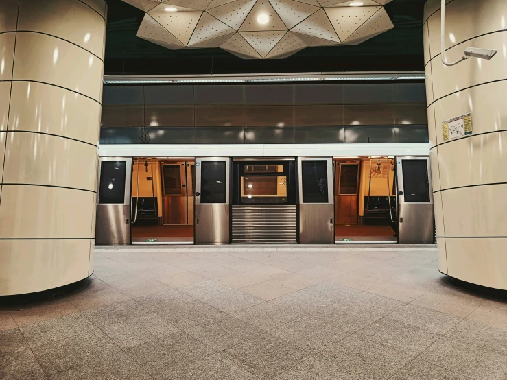 the front entrance to a el with three lift doors