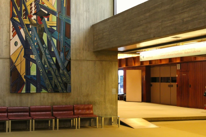 a public building has an empty hall and chairs