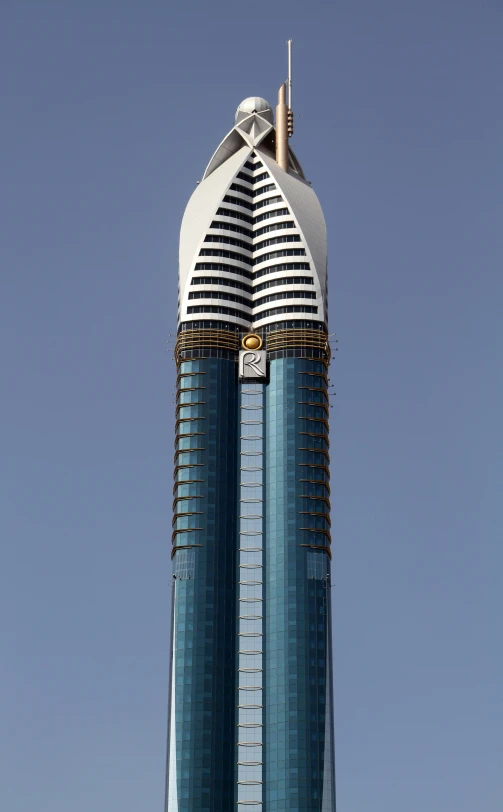 a tall buliding building with a clock on it's side