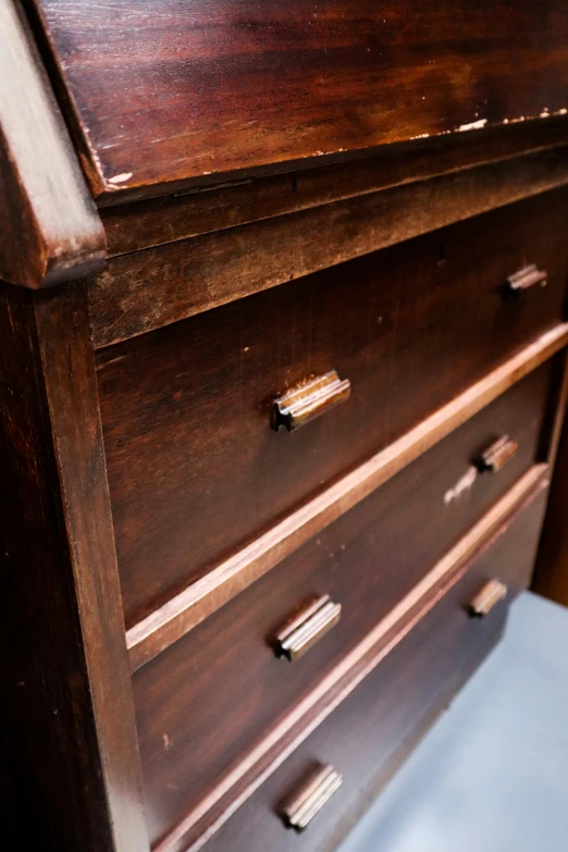 a close up of an old wooden dresser