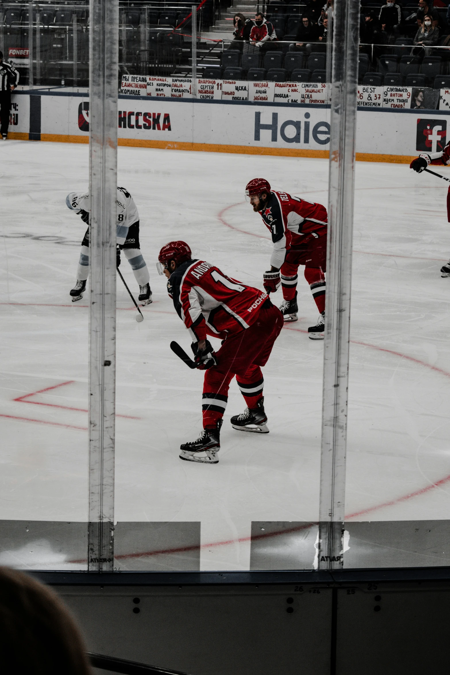 a group of people on a hockey field playing