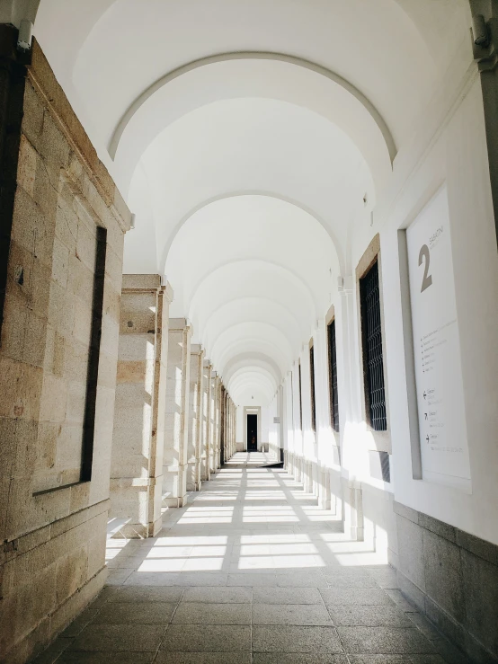 a line of long, arched hallway between two buildings